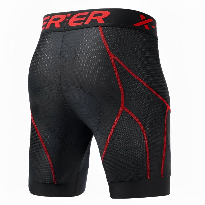 Black compression shorts with red accents on a white background