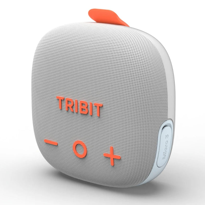 White Tribit portable speaker with orange accents on a white background