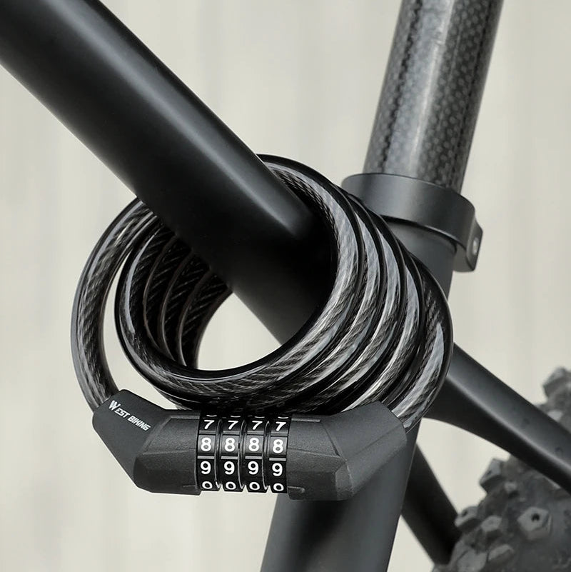 A black bicycle cable lock with a three-digit combination lock, wrapped around the frame of a dark bicycle.