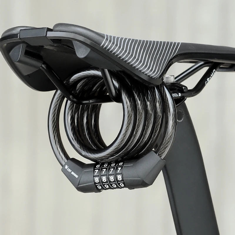 A black bicycle saddle lock with a triple dials combination lock and coiled steel cable, shown attached to a bicycle saddle.