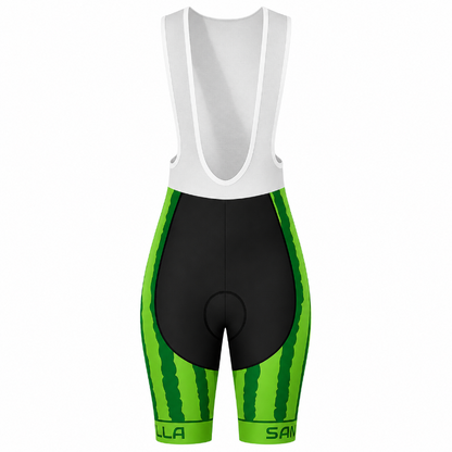 A pair of cycling bib shorts with a watermelon print design, featuring a white bib upper section, a black central padding area, and bright green and dark green striped sides, shown against a plain white background.