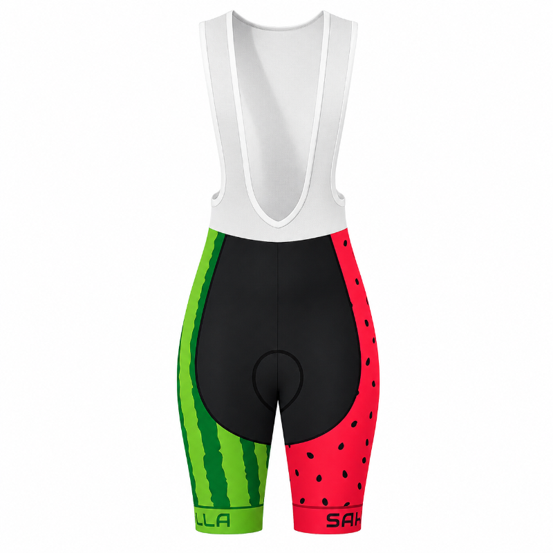 A pair of women's cycling bib shorts with a watermelon-themed print. The upper bib portion is solid white, while the leg sections feature a split design: one side has a green watermelon rind pattern, and the other has a red watermelon seed pattern.