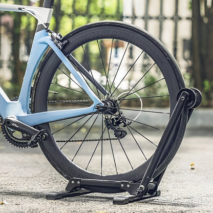 Bicycle wheel on a stand with a blurred outdoor background