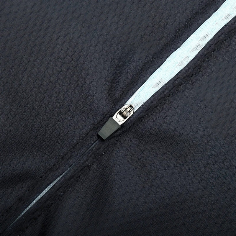 Close-up of a zipper on a textured black fabric background