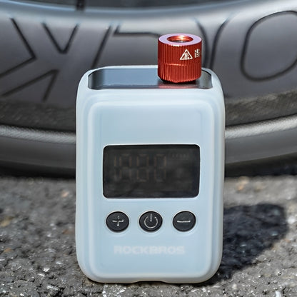 Digital tire pressure monitor with a red light on a tire background