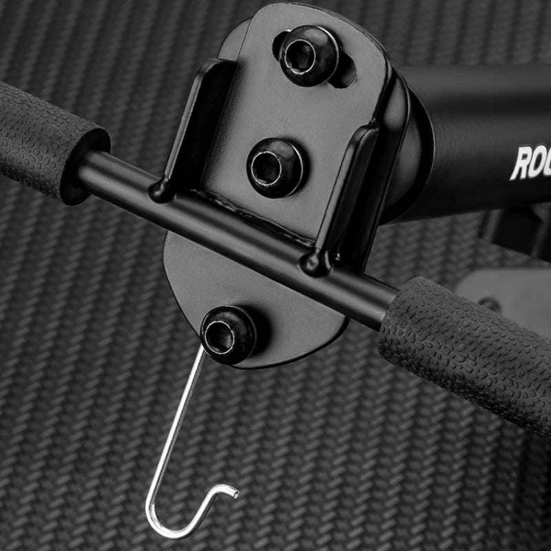 Close-up of a fitness machine handle with a hook attachment on a textured background
