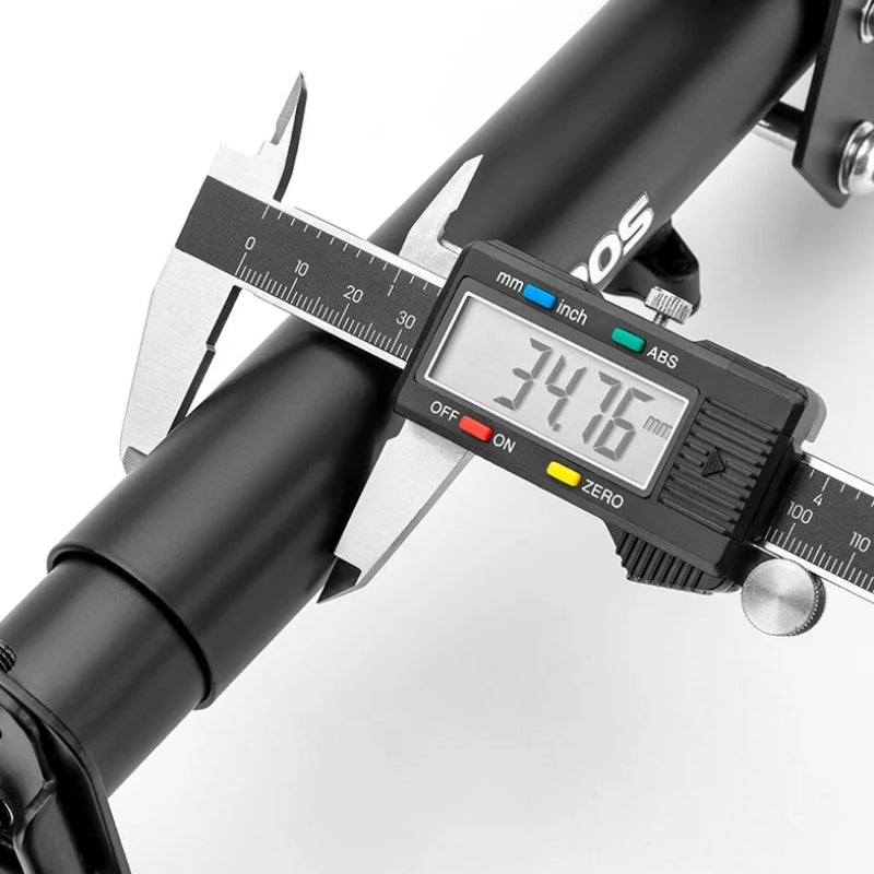 Digital caliper measuring a bicycle fork on a white background