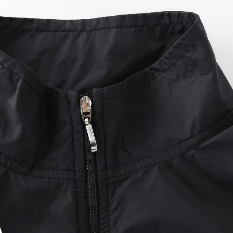 Black jacket with zipper detail on a white background