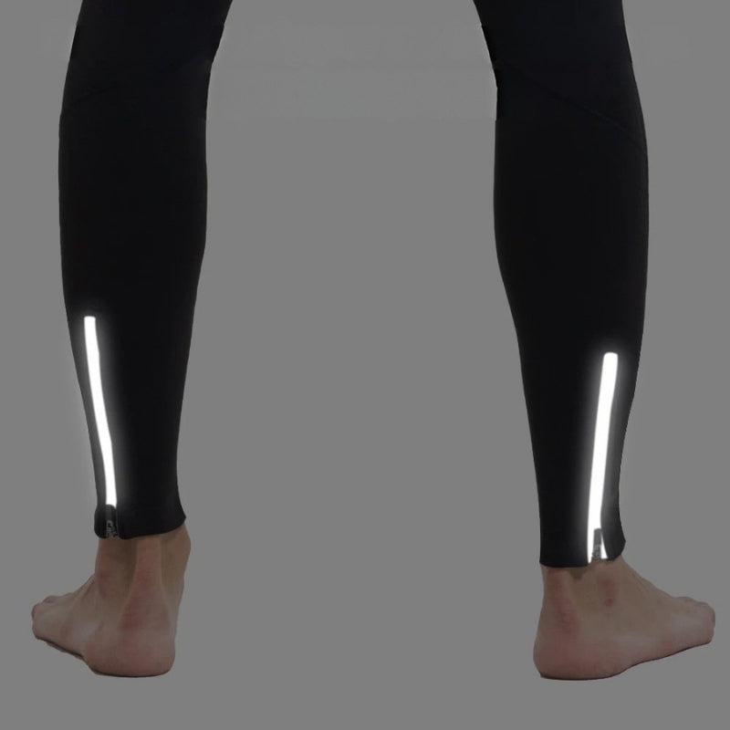 Black leggings with reflective stripes on a gray background