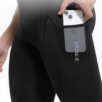 Person wearing black cycling pant with a phone pocket 