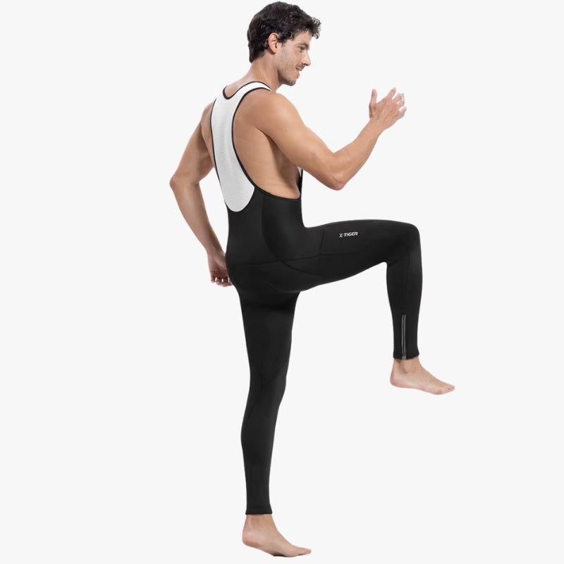 Person wearing a black and white wetsuit on a white background