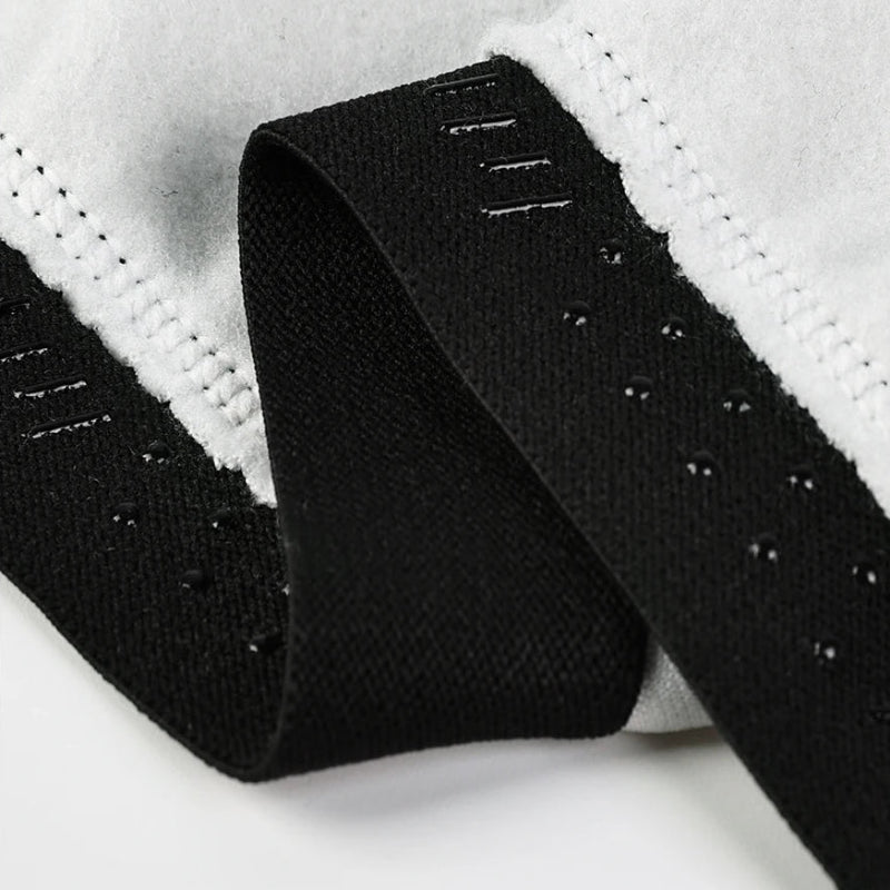 Close-up of a black belt with textured surface on a white background