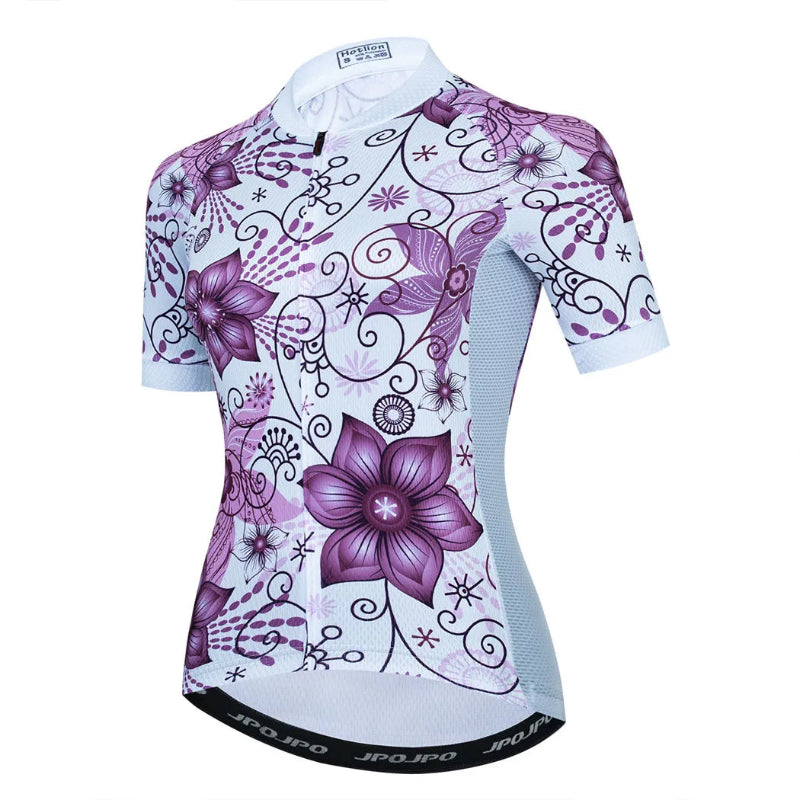 Cycling jersey with purple floral design on a white background