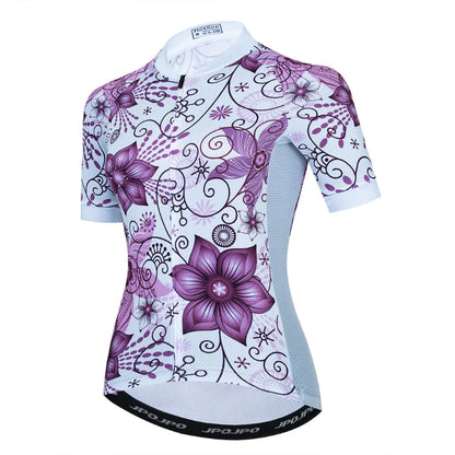 Cycling jersey with purple floral design on a white background