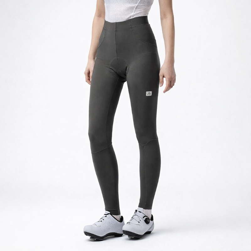 Person wearing dark gray riding pants on a white background