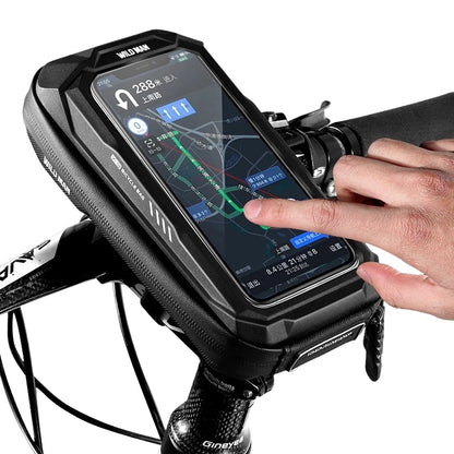 Hand using a smartphone in a black bike mount with a clear background