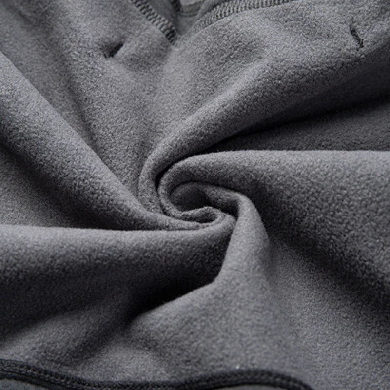 Close-up of dark gray fleece fabric with visible texture