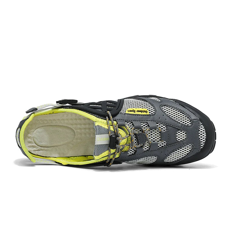 A single water shoe shown from a side profile view on a white background. The shoe features a gray and white mesh upper, black trim, gray laces, and a bright neon yellow lining.