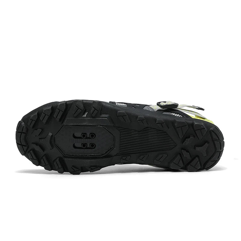 A close-up view of the black rugged sole of a cycling shoe, showing the tread pattern and heel design, on a white background.