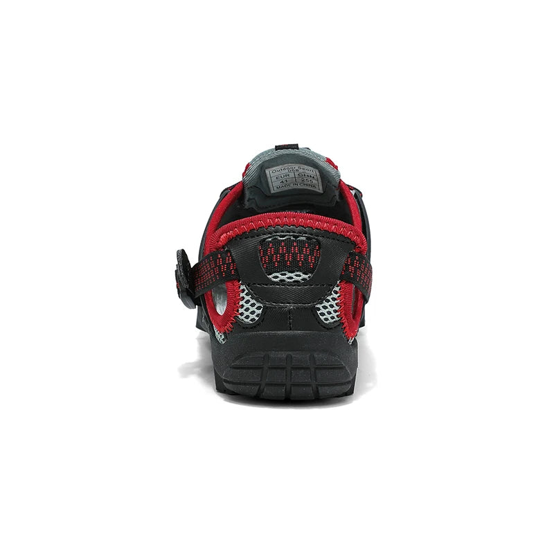 A single black and red athletic shoe shown from the back on a white background.
