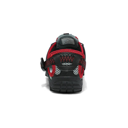 A single black and red athletic shoe shown from the back on a white background.