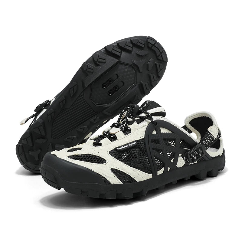A pair of black and off-white outdoor water shoes with a rugged sole, shown on a clean white background. One shoe is positioned to show the textured black outsole, while the other is angled to display the side profile and mesh upper.
