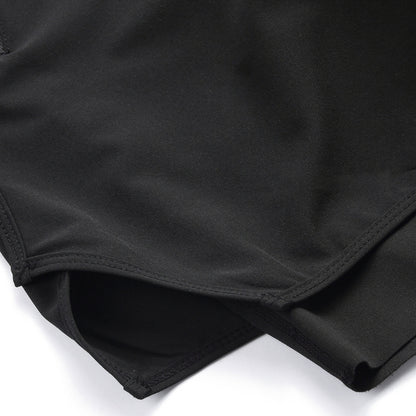 Close-up of black fabric with a white background