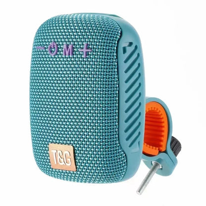 Teal portable speaker with a clamp attachment on a white background