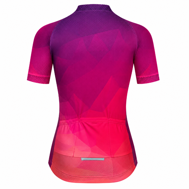 Short-sleeve cycling jersey shown from the back, featuring a geometric gradient pattern transitioning from deep purple at the shoulders to bright pink and red at the hem.