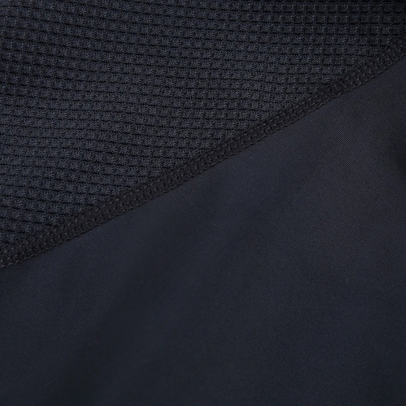Close-up of two different textures of black fabric