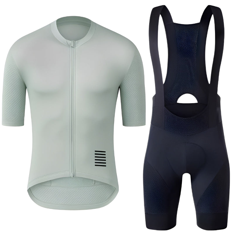 Light green cycling jersey and black bib shorts on a white background