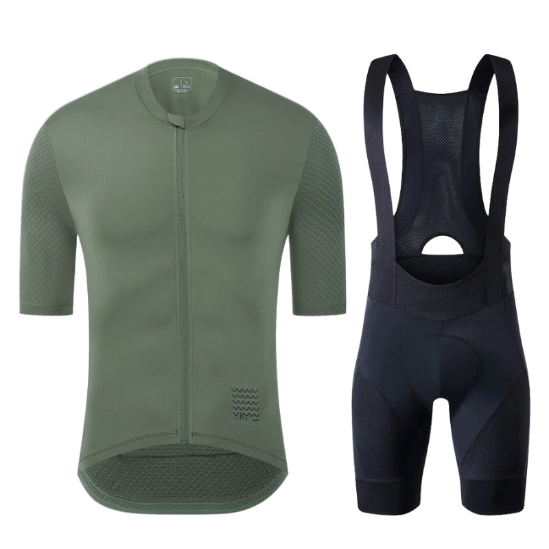 Green cycling jersey and black bib shorts on a white background