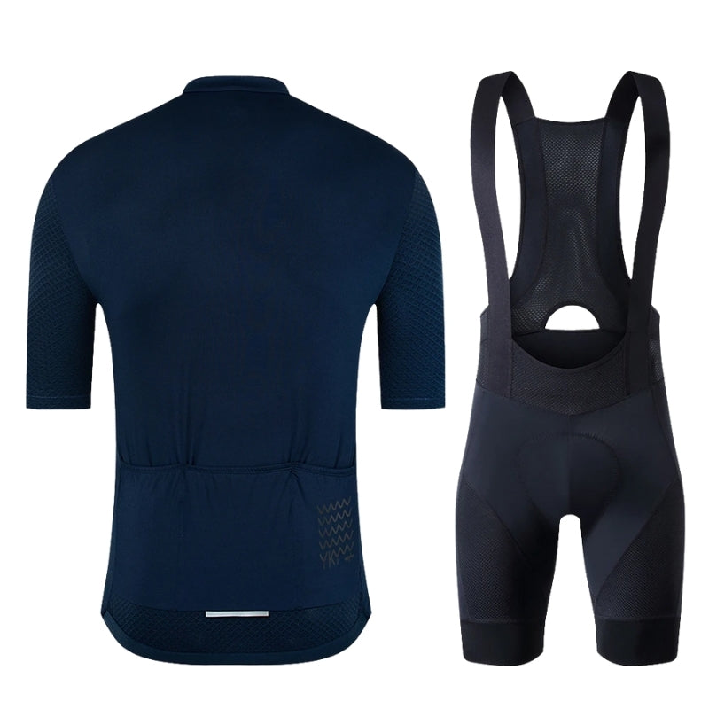 Navy blue cycling jersey and bib shorts on a white background