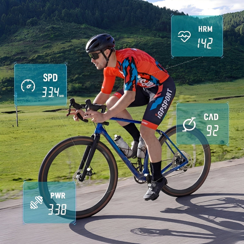 Cyclist on a road bike with performance metrics displayed on digital screens.