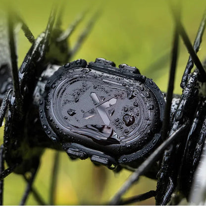 Waterproof watch with IPX7 rating on a background of wet grass and leaves.