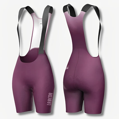 Purple cycling bib shorts with black straps on a light gray background