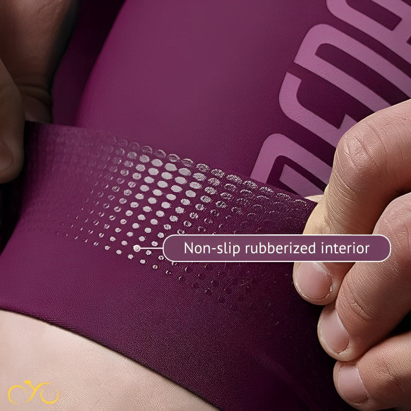 Close-up of a purple sports bra with a non-slip rubberized interior, held by a hand.