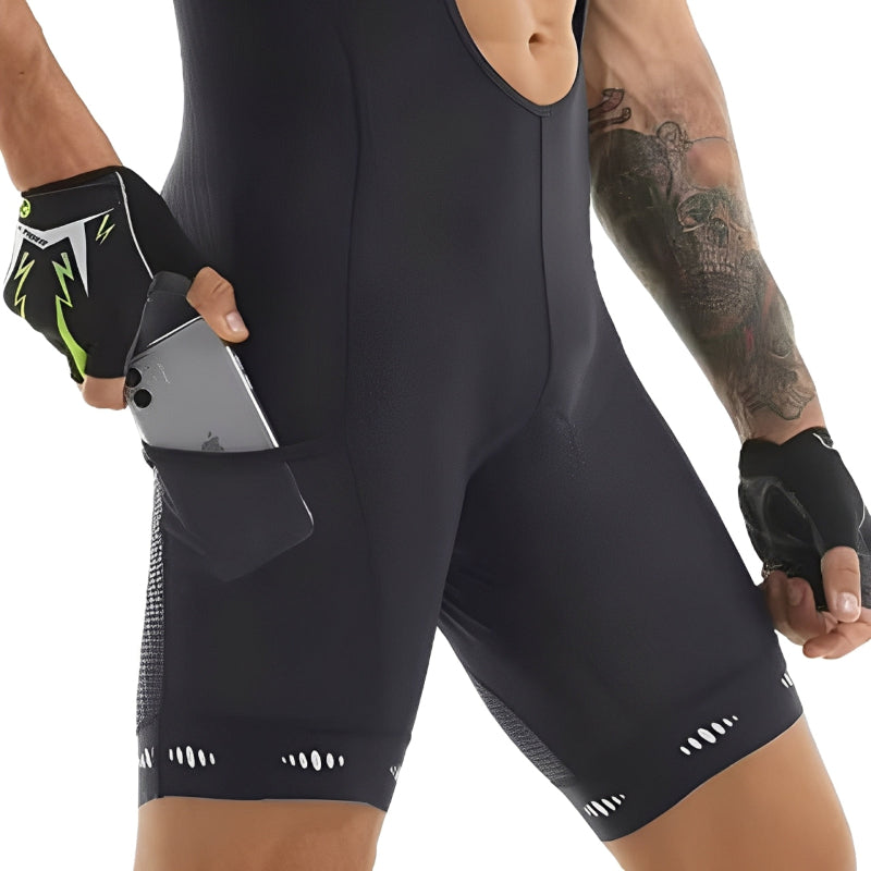 Person wearing black athletic shorts with a pocket, holding a phone.