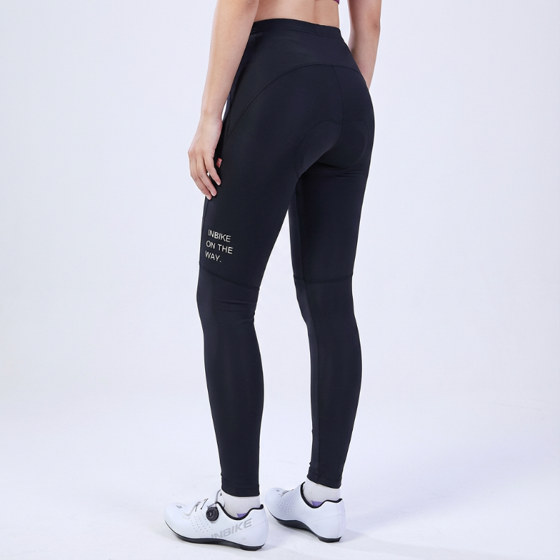 Black leggings with text on the back worn by a person on a white background