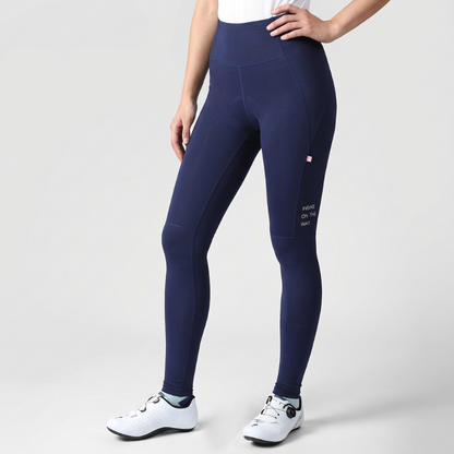Navy blue leggings worn by a person on a light gray background