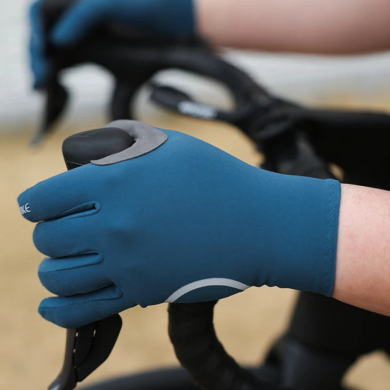 yclist wearing gloves cycling for protection during cold weather rides