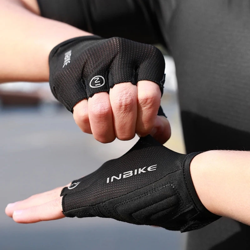 Person wearing black gloves with a blurred background