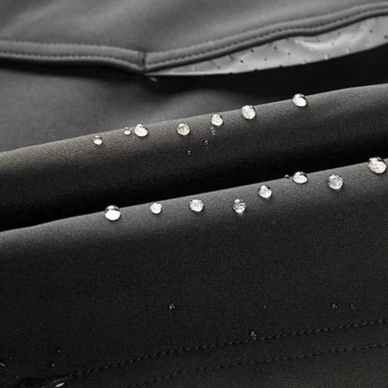 Close-up of water droplets on a black surface