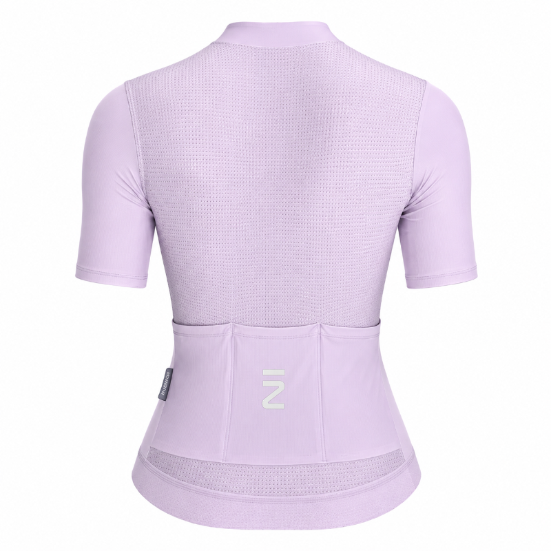 A light purple short-sleeve cycling jersey shown from the back, featuring a textured mesh back panel, a high collar, and a rear pocket system with a white stylized 'Z' logo on the center pocket.