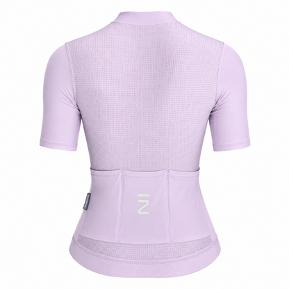A light purple short-sleeve cycling jersey shown from the back, featuring a textured mesh back panel, a high collar, and a rear pocket system with a white stylized 'Z' logo on the center pocket.