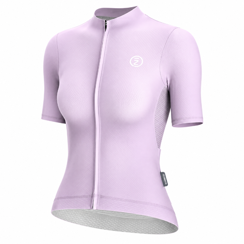 A light purple short-sleeve cycling jersey with a full-length front zipper, a white circular logo on the left chest, and a gray inner lining visible at the curved hem, shown on a plain white background.