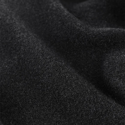 Close-up of black fleece fabric with text highlighting features