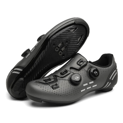 Black cycling shoes with a white sole on a white background