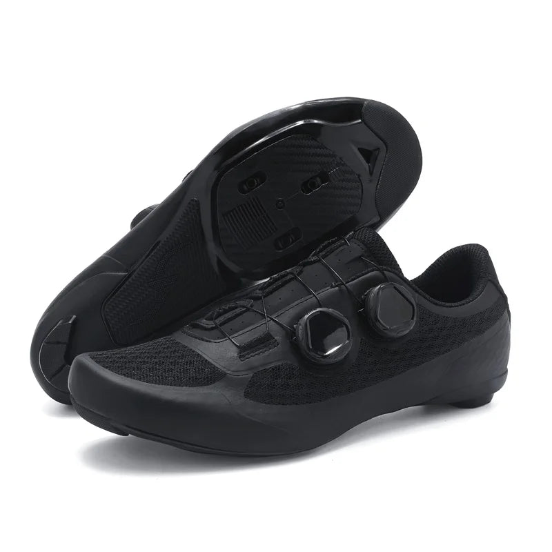Black cycling shoes with cleats on a white background