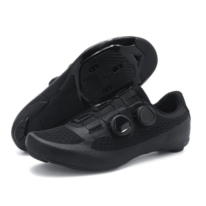 Black cycling shoes with cleats on a white background
